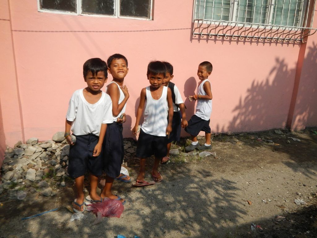 Children of a Philippine neighbourhood standing together